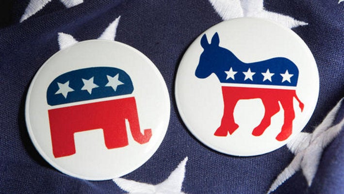 Two political campaign buttons showing the mascots for both primary U.S. political parties: the Republican elephant and the Democratic donkey.
