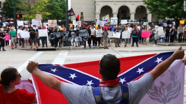 Demonstrators and counter-protestors gather at the so-called "Stop Islamization of Texas" rally, an event organized on Facebook by a Russian-linked page