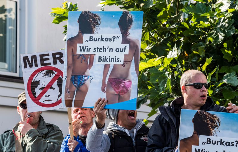 Members of the Alternative for Germany (AfD) party protest at an Angela Merkel rally in September 2017.