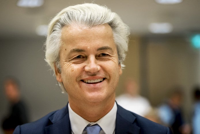 Dutch politician Geert Wilders smiles at the camera.