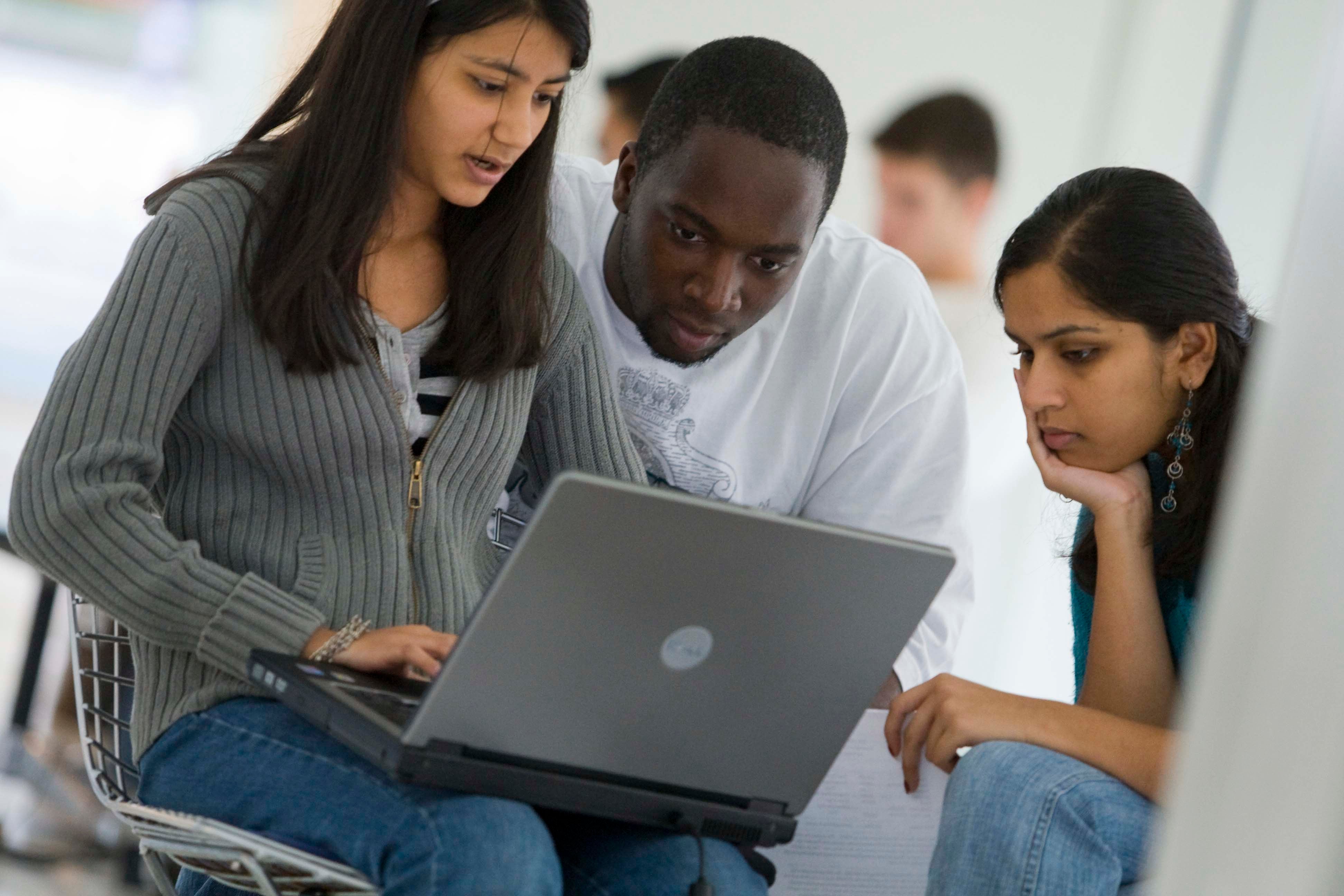 Photo of a students using a laptop at the Stamford Campus.