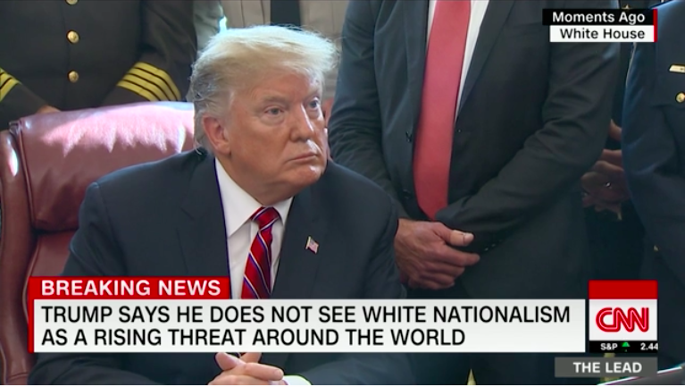 Screenshot of President Trump during a press conference in March 2019 from the White House. The chyron text reads: “Trump says he does not see white nationalism as a rising threat around the world.”