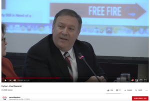 Screen shot from the Center for Security Policy's YouTube channel of then-Congress Member Mike Pompeo seated at a table while speaking into a mic. Below the image is text that reads, "Defeat Jihad Summit" and "24,304 views."