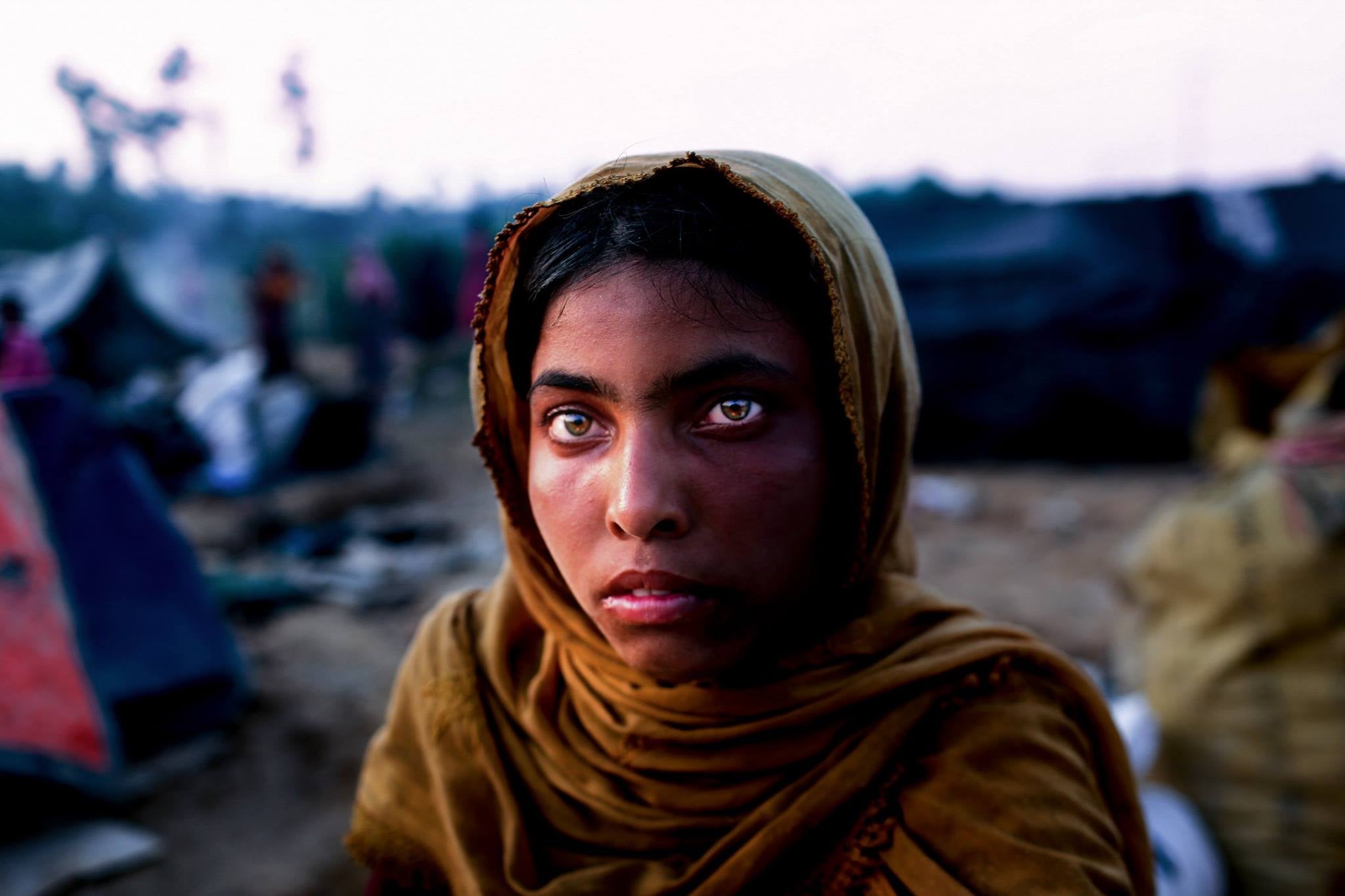 Shima (16) traveled miles after miles with her family from Myanmar to enter Bangladesh for safe refuge.